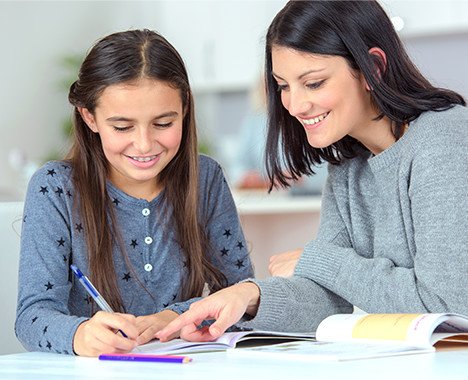 An Austin tutor helps a student with their homework