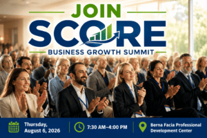 Diverse business professionals applaud at the SCORE Business Growth Summit event.