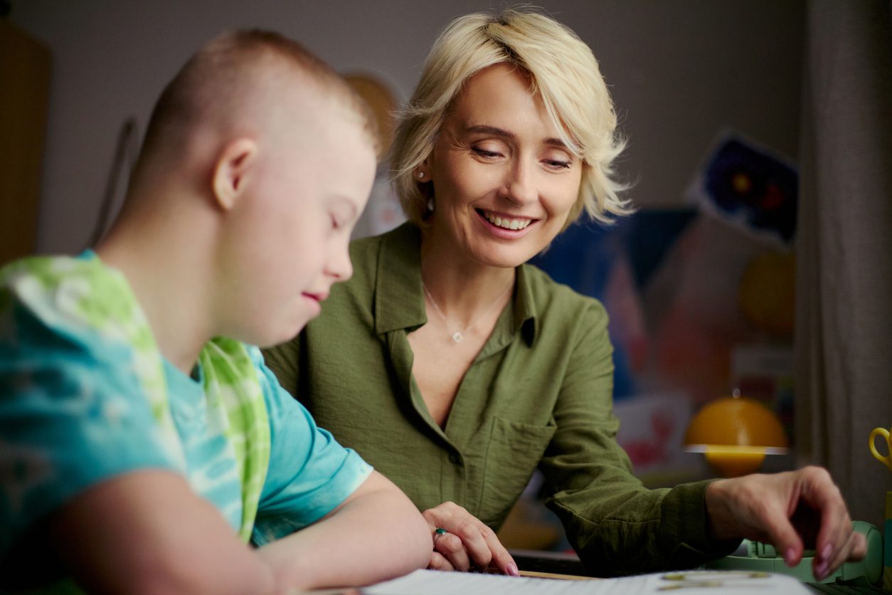 Tutor working one-to-one with an exceptional learner