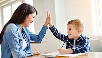 An Ellenwood tutor gives her student a high-five