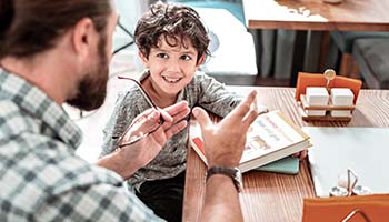 A Calgary English tutor helps a young student