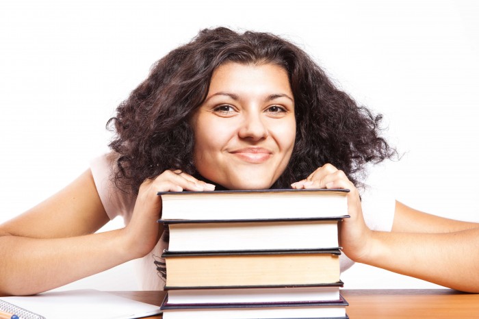 College Student Smiling with Books College Student Smiling with Books