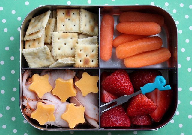 School Lunchbox with cheese, meat, frut and crackers