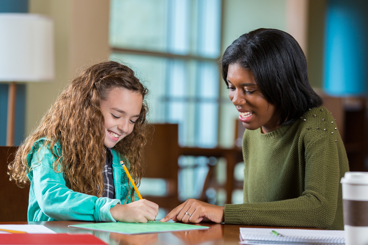 A tutor in Minneapolis helps a student with school work