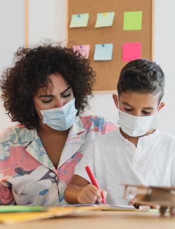 tutor and student in covid mask