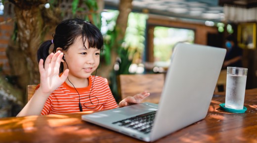 little girl doing online english tutoring