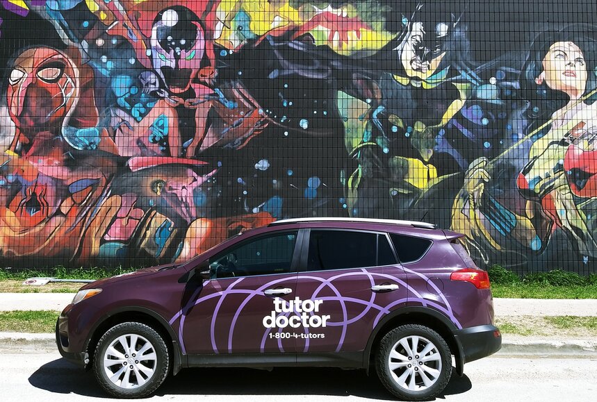 Tutor Doctor branded car infront of wall art