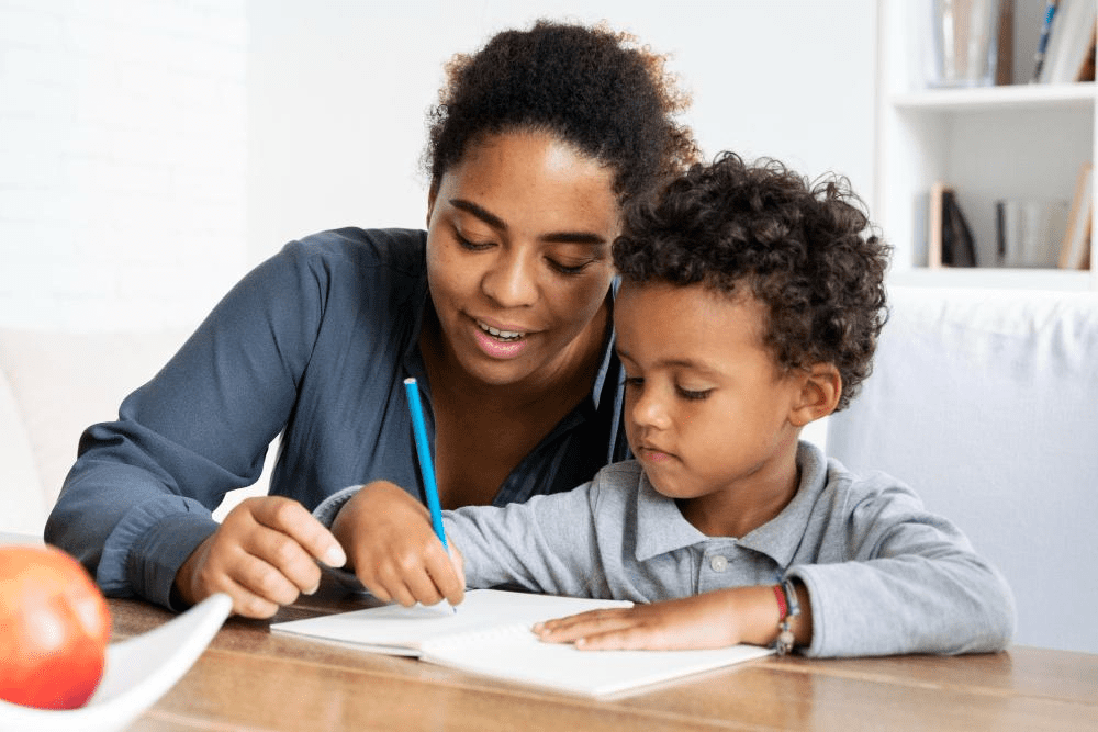 A Tutor Doctor Tutor works with a child to help them learn.