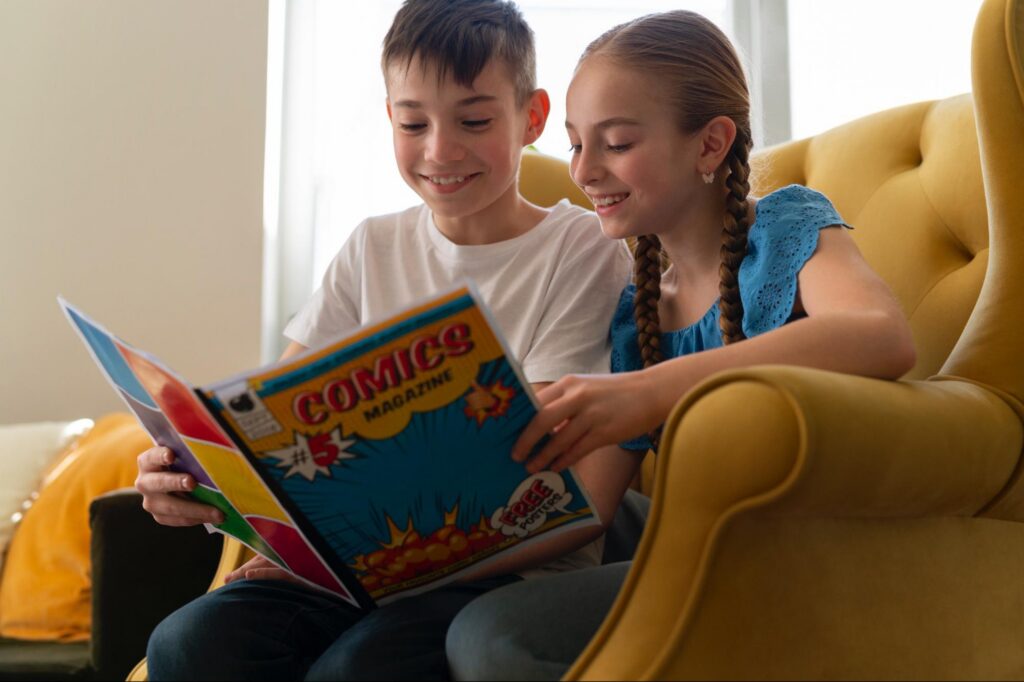 Siblings read together at home