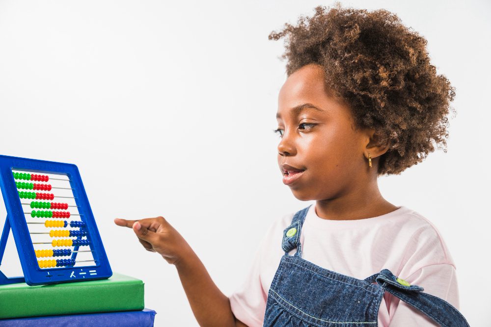 Child uses an abacus to practice math